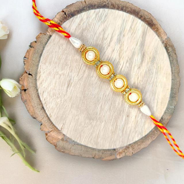 Radiant Harmony: Four Pearl Designer Rakhi