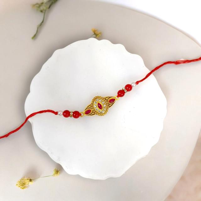 Crimson Sparkle Red Kundan Rakhi: A dazzling symbol of eternal love and protection.