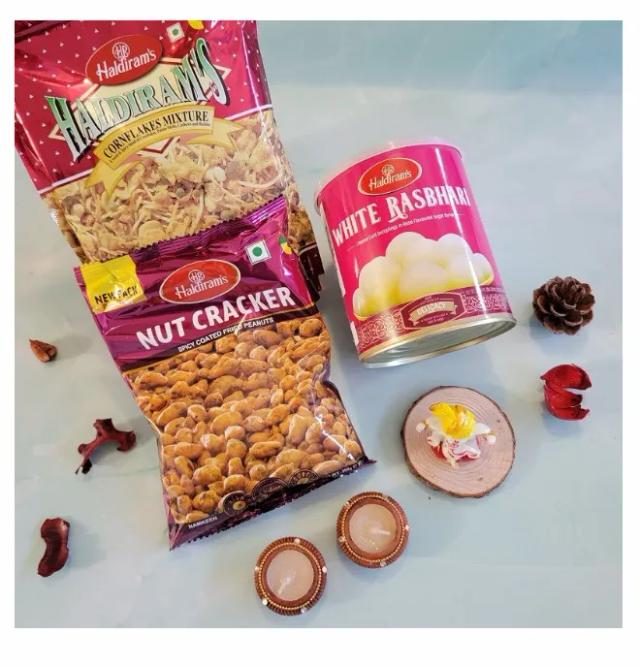 Haldiram Cornflakes Mix N Nutcracker With Ganpati Idol, Kaju Katli And Diyas Hamper