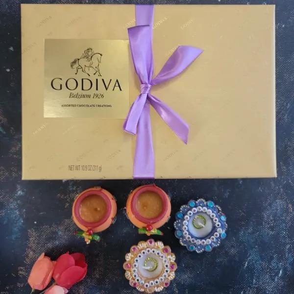 Four Diyas With Chocolate Box