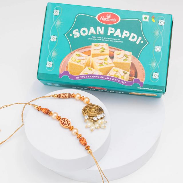 Om Divine Glow Rakhi Set with Soan Papdi