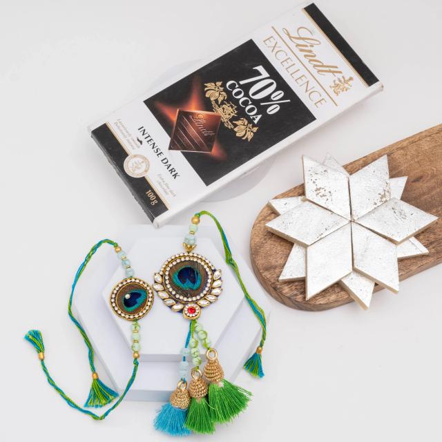 Majestic Peacock Rakhi Set with Exquisite Sweets & Chocolate
