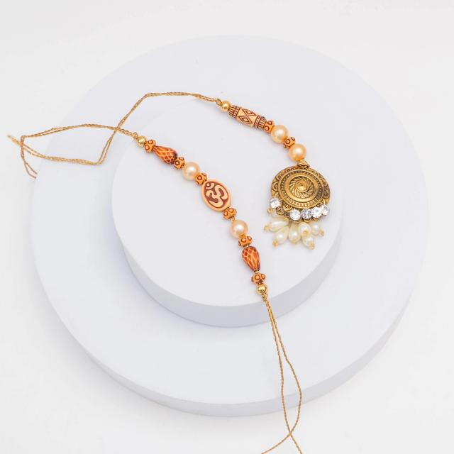 Divine Harmony Om & Gold Rakhi Duo