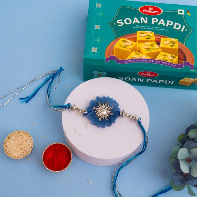 Radiant Sunbeam Rakhi with Blue Elegance & Soan Papdi