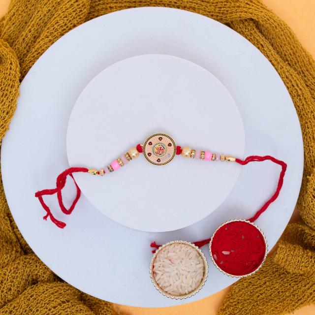 Divine Om Rakhi with Gourmet Kaju Katli