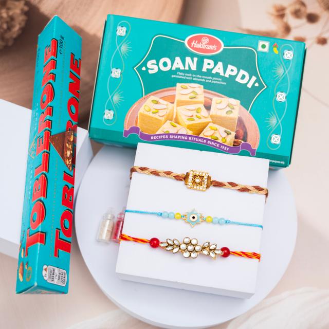 Luxe Rakhi Trio & Sweets Delight Combo