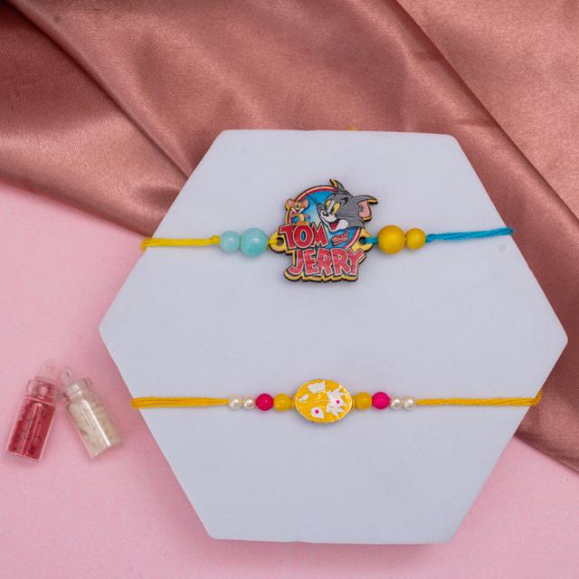 Elegant Yellow Stone & Playful Tom-Jerry Rakhi Combo with KitKat & Kaju Katli