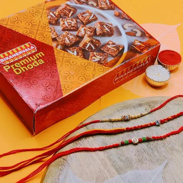 Trio Colourful Om Stone Thread Traditional Rakhi With Premium Dhoda