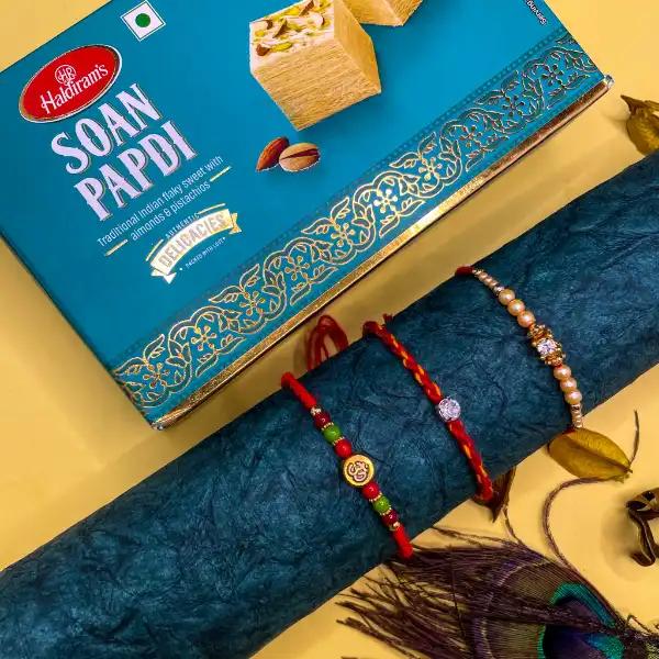 3 Enticing Rakhis Set With Soan Papdi