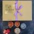 Four Diyas With Chocolate Box