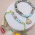 Elegant Evil Eye Bracelet Rakhi with Gulab Jamun Delight