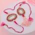 Elegant Pink Pearl Rakhi Set with Sweets & Almonds