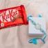 Charming Blue Blossom Rakhi with KitKat Bar