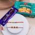 Vibrant Eye & Earthy Stone Rakhi Combo with Dairy Milk & Soan Papdi