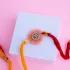Divine Om Resin Rakhi with Soan Papdi Delight