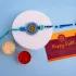 Divine Om Resin Rakhi with Dodha Bliss