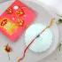 Divine Ganesha Rakhi & Dodha Burfi Blessings Combo