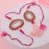 Elegant Pink Pearl Rakhi & Sweet Delight Combo