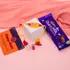 Radiant Stone Rakhi with Yellow Thread & Dairy Milk Delight
