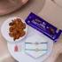 Sparkling Diamond & Protective Evil Eye Rakhi Set with Almonds & Dairy Milk Bar